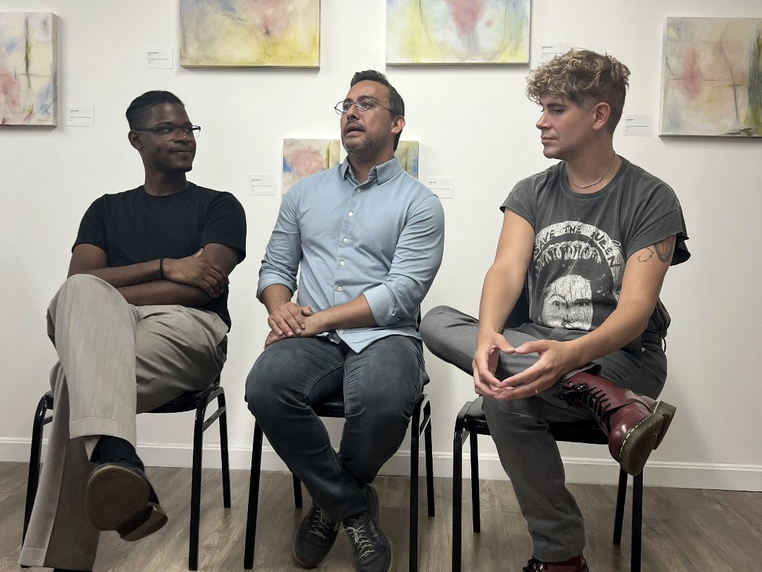 Edward Rocha speaking on a panel with two creative professionals