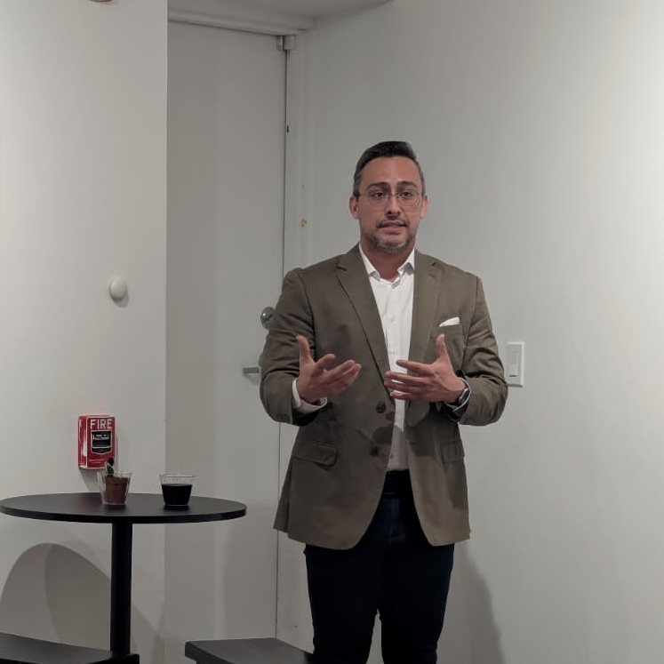 Edward Rocha speaking to a group